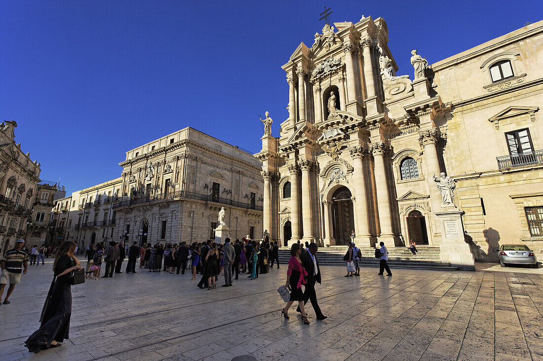 People visiting cathedral, Syracuse, Ortygia island, Sicily, Italy