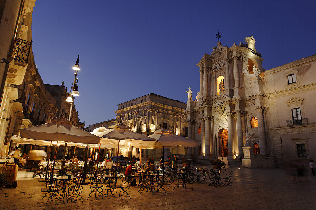 Place Cathedral with pavement cafe and cathedral in the evening, Syracuse, Ortygia island, Sicily, Italy