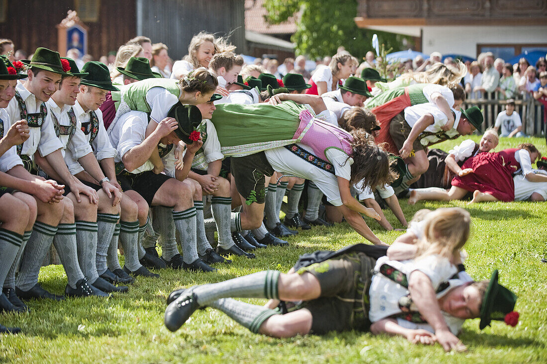 Young people wearing traditional costumes, May Running, Antdorf, Upper Bavaria, Germany
