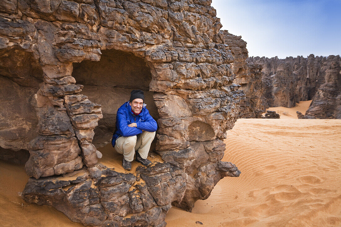 Tourist in the stony desert, Tassili Maridet, Libya, Sahara, Africa
