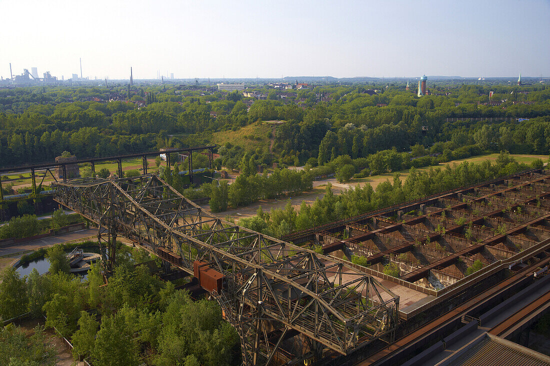 View from Blast furnace No. 5 in North Duisburg Landscape Park at water tower and St Joseph's church in Duisburg-Hamborn, Former Meiderich Ironworks, Closed down in 1985, Industrial Heritage Trail, Ruhrgebiet, North Rhine-Westphalia, Germany, Europe