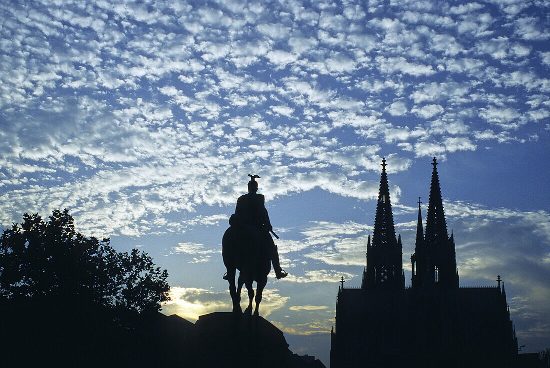 Cathedral and Hohenzollern Bridge with equestrian sculpture, Cologne, Rhine river, North Rhine-Westphalia, Germany
