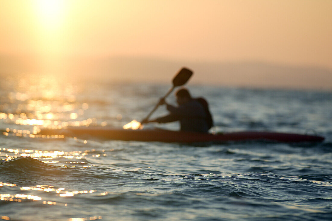 Surf kayak on Lake Chiemsee, Chiemgau, Bavaria, Germany