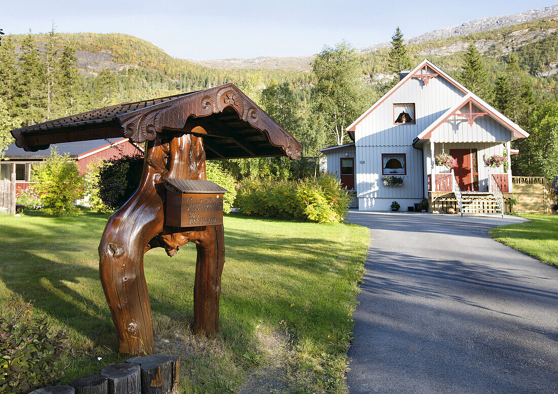 Wooden letter box in front of residential house, Norway, Scandinavia, Europe