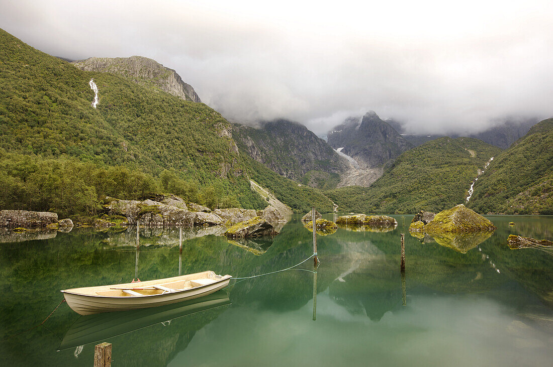 View at the glacier Bonhusbrea with the green sea Bondhusvatnet and boat in the foreground, Sunndal, Folgefonn peninsula, Kvinnherad, Hordaland, Norway, Scandinavia, Europe