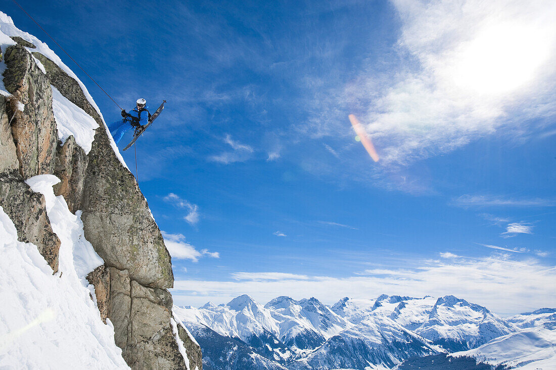 Skier rappeling, Disentis, Surselva, Grisons, Switzerland