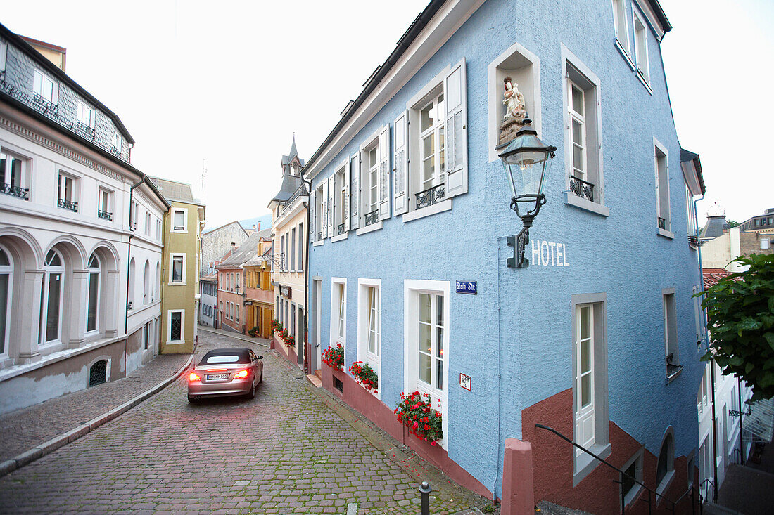 Convertible passing a hotel, Baden-Baden, Baden-Wuerttemberg, Germany