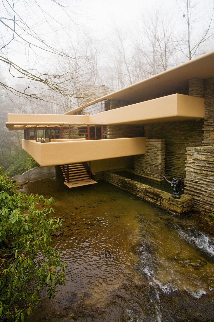 An approach side view of Fallingwater shows the home´s famous cantilevered balconies and a sculpture by Lipchitz lower right  Also known as the Edgar J  Kaufmann Sr  Residence, Fallingwater was designed by American architect Frank Lloyd Wright in 1934 i