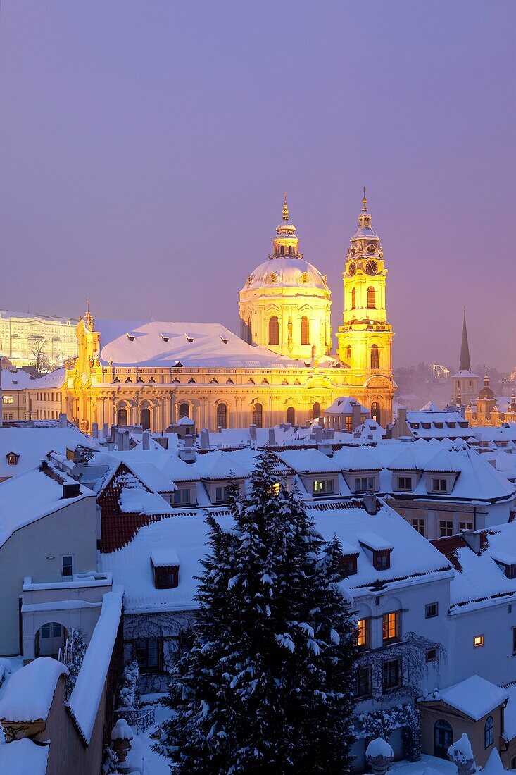 prague - st  nicolaus church and roofs of mala strana in winter