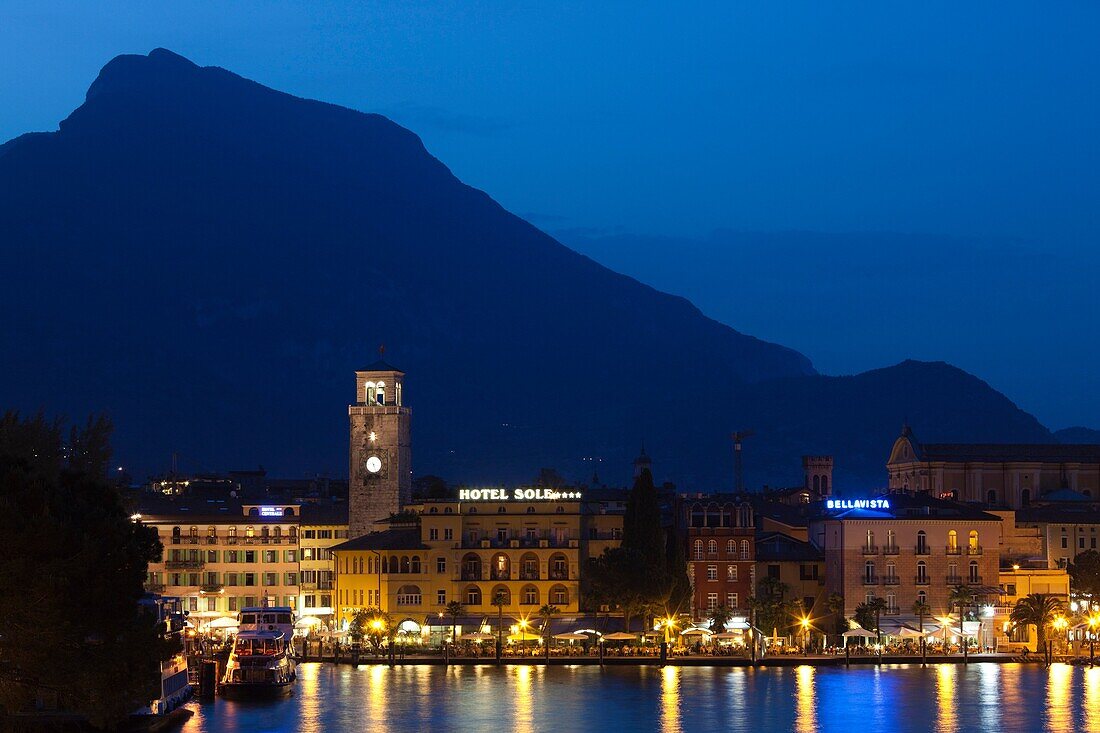 Italy, Trentino-Alto Adige, Lake District, Lake Garda, Riva del Garda, town view with Torre Apponale, 13th century tower, evening