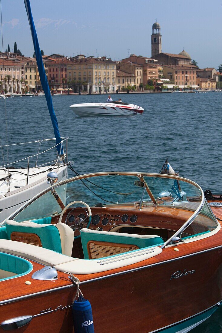 Italy, Lombardy, Lake District, Lake Garda, Salo, town view with Riva speedboat