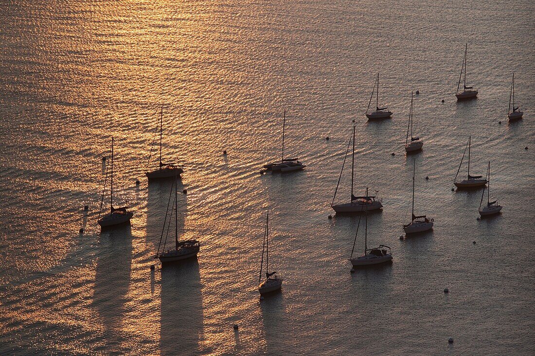 USA, Massachusetts, Boston, Boston Harbor sunrise reflection with sailboats, high angle view, dawn