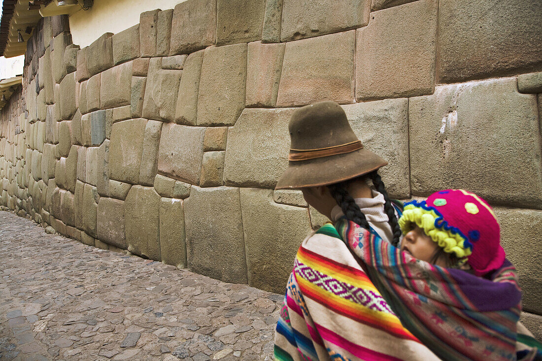 Stone wall of the old sovereign Inca Roca´s palace, now part of the Archbishop´s Palace in the Hatun Rumiyoc street, Cusco, Peru