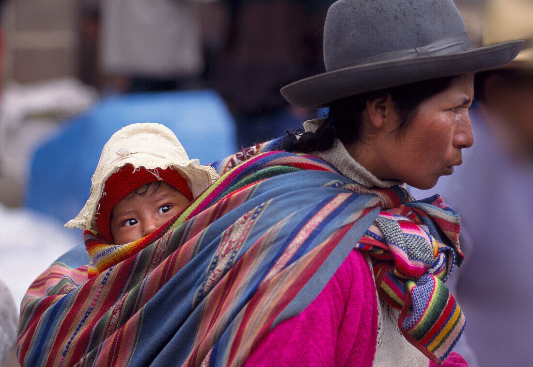 Woman with child, Incan market of Pisac, Cusco region, Peru