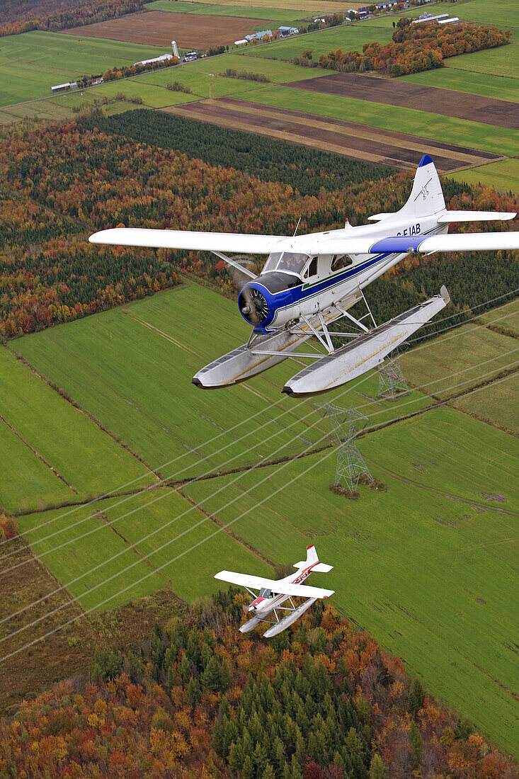 Flying over East counties in seaplane at fall, Quebec, Canada