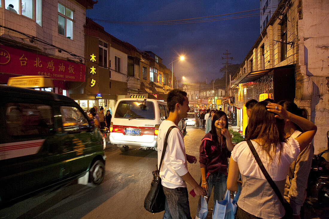 Young people and students at YuanXi street in the evening, shopping street with cafes and restaurants, Kunming, Yunnan, People's Republic of China, Asia
