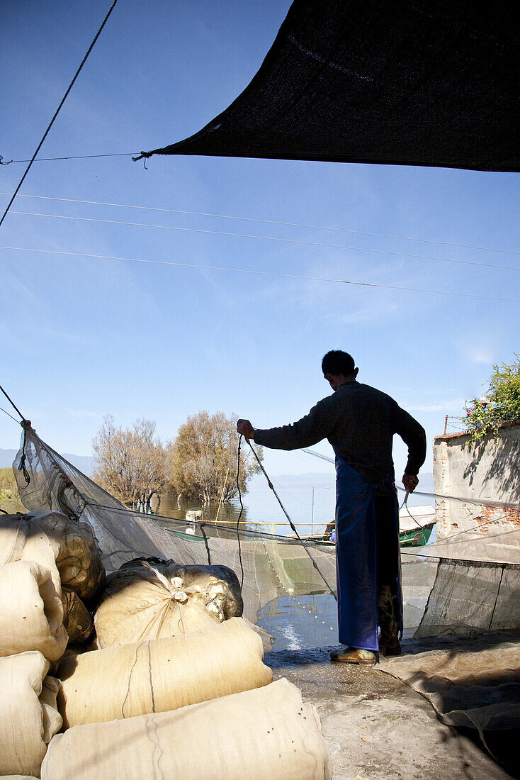 Fisherman at Erhai lake, Dali, Yunnan, People's Republic of China, Asia