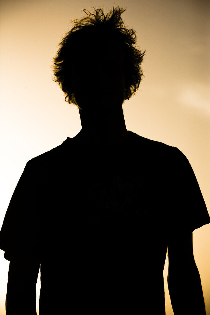 Silhouette of a young man against the evening sky, Sagou, Mali, Africa