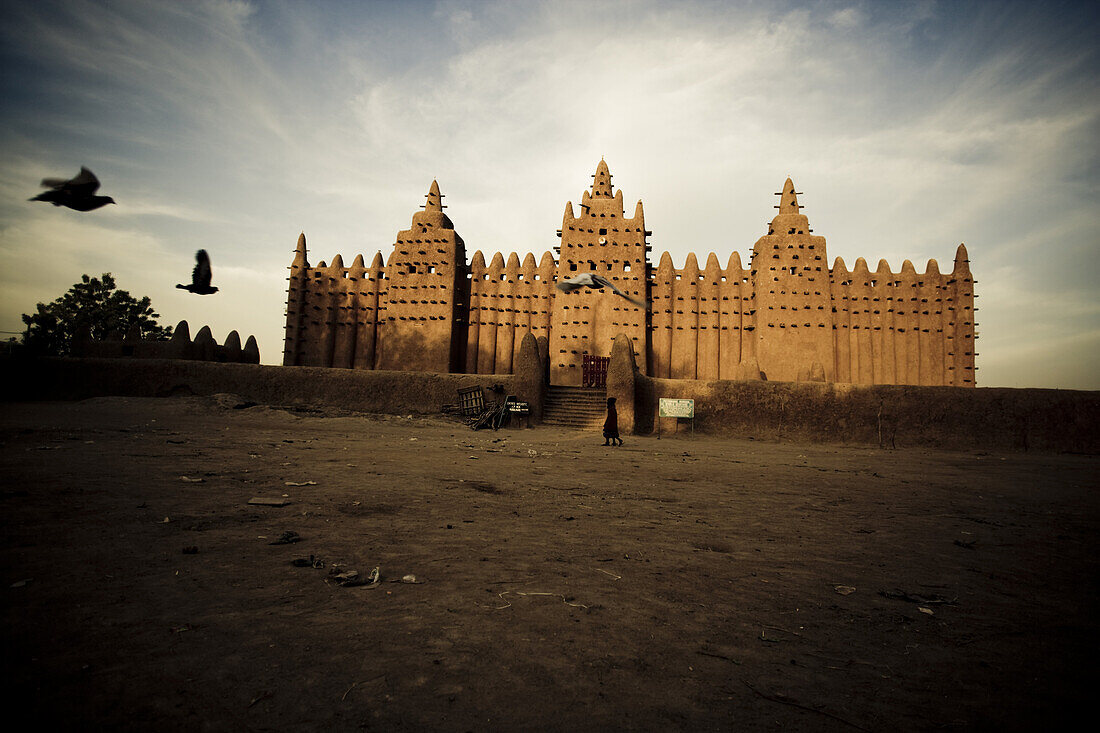 Mosque of Djenna under clouded sky, Mali, Africa