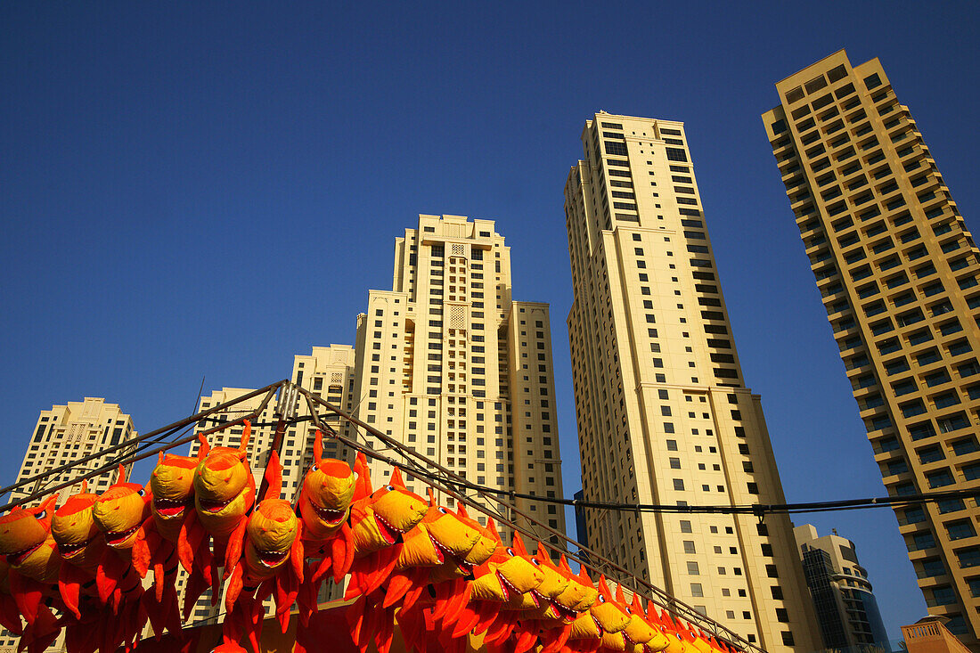 Stall on a fairground and high rise buildings under blue sky, Jumeirah Beach Residence, Dubai, UAE, United Arab Emirates, Middle East, Asia