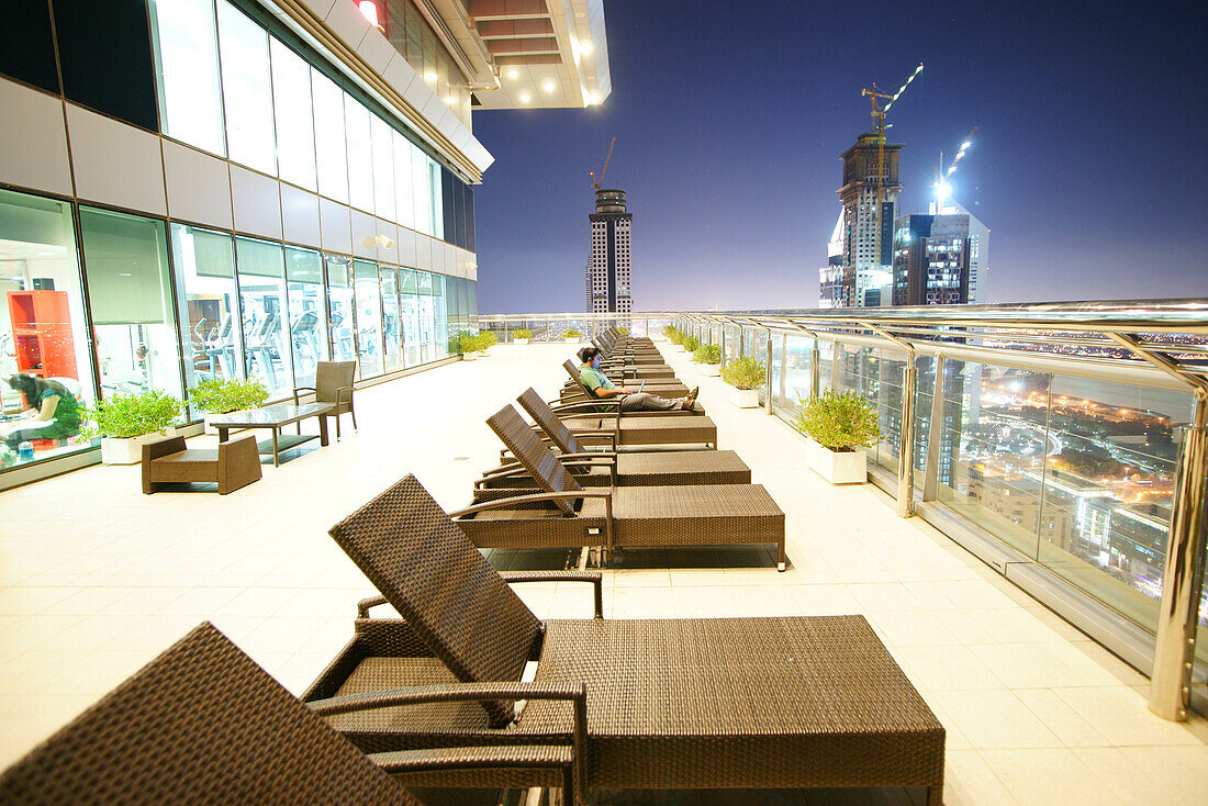 Sunloungers on a hotel roof terrace in the evening, Dubai, UAE, United Arab Emirates, Middle East, Asia