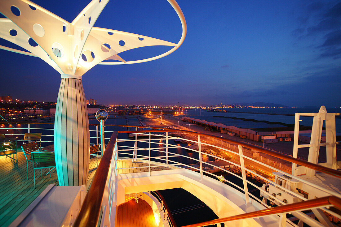 Deck and railing on cruise ship AIDA Bella in the evening, Mediterranean Sea