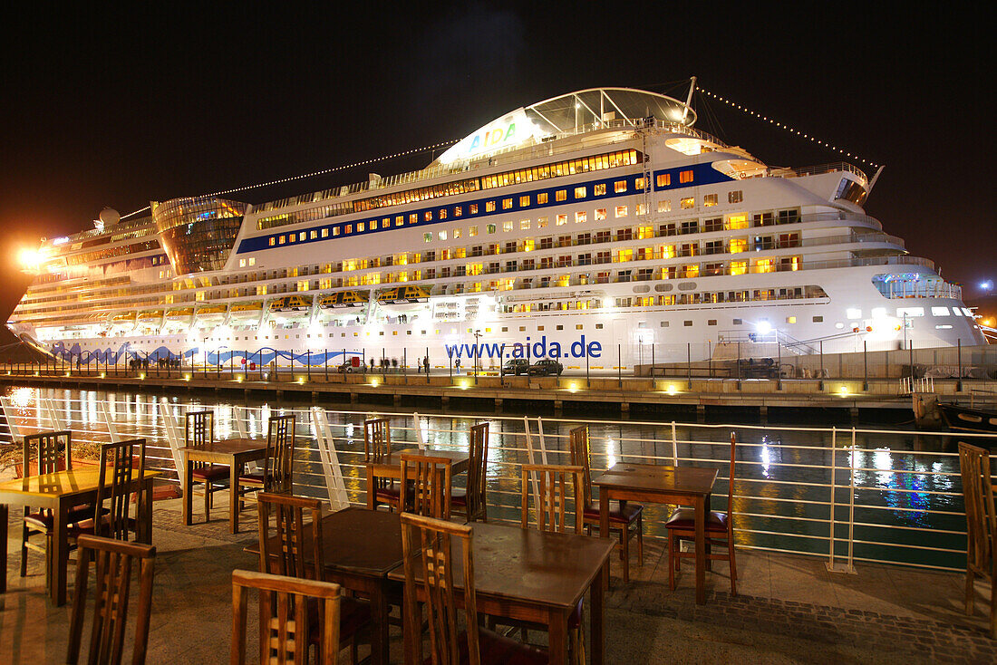 The illuminated AIDA Bella Cruise ship at the port of Valletta, Malta, Europe