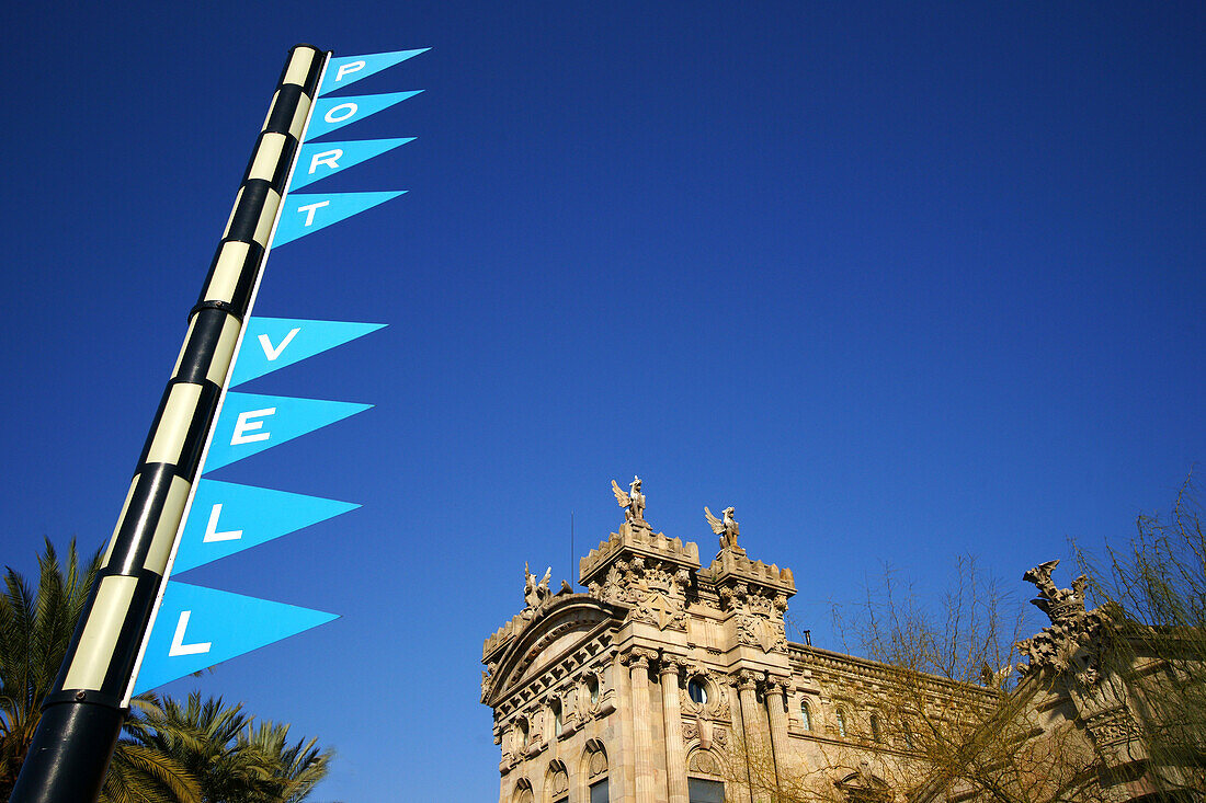 Flags and building under blue sky, Port Vell in Barcelona, Spain, Europe