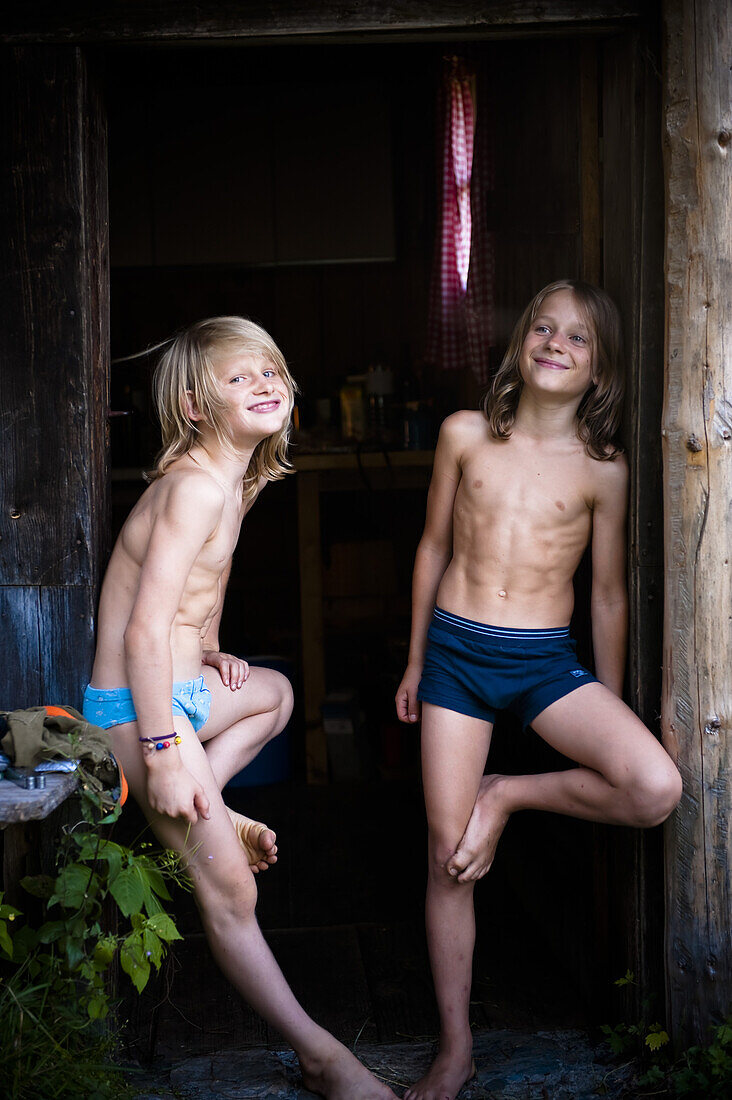 Two boys standing in an entrance, Austria