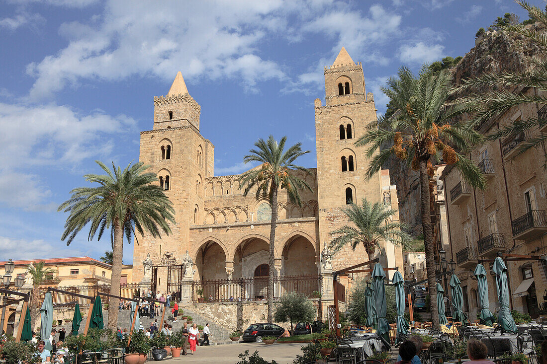 People at San Salvatore Cathedral at the square Piazza Duomo in Cefalù, Province Palermo, Sicily, Italy