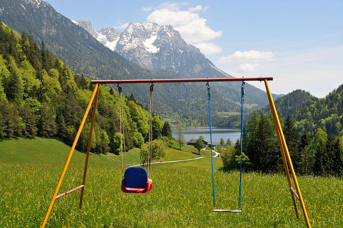 Swings at lake Hintersteiner near Scheffau at Wilder Kaiser, Tyrol, Austria
