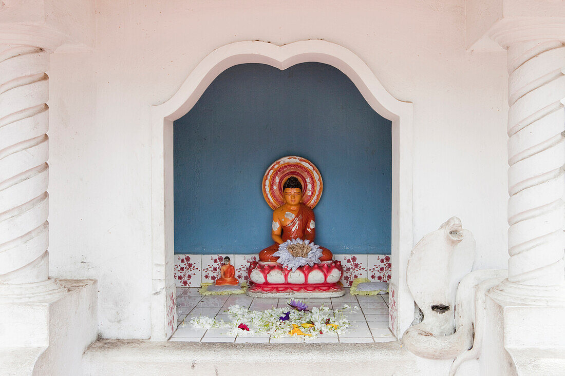 Little Buddha statue in front of the cave temple of Dambulla, Dambulla, Sri Lanka, Asia