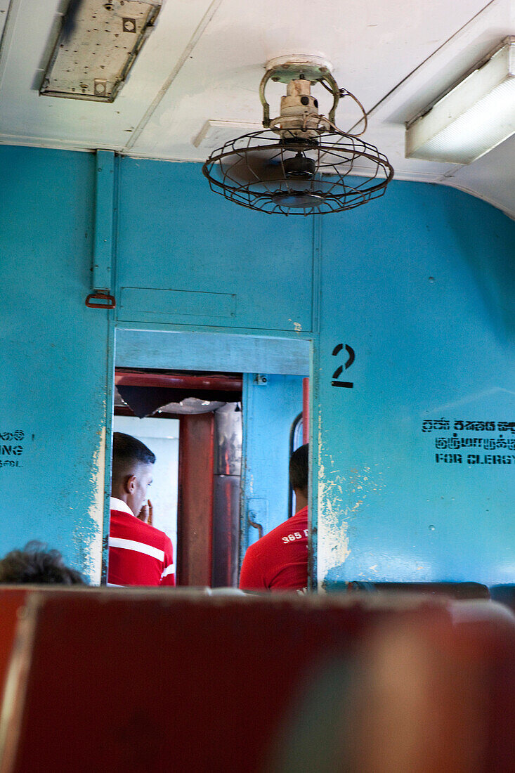 Sinhalese men in the train between Colombo and Badulla, Nuwara Eliya, Highland, Sri Lanka, Asia