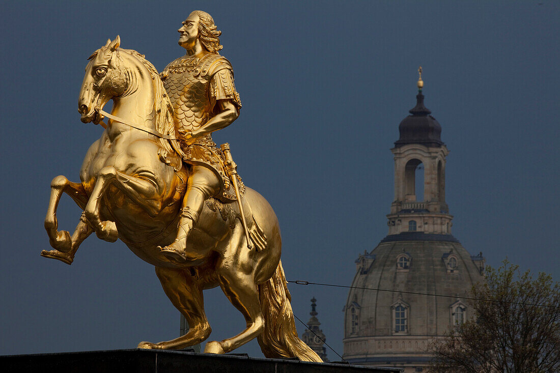 Der goldene Reiter, The golden equestrian sculpture of King Augustus the Strong, August II, dome of the Frauenkirche, Church of our Lady in the background, Dresden, Saxony, Germany