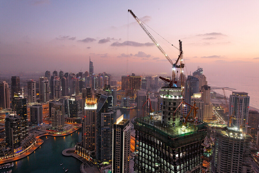 Dubai Marina at sunset, skycrapers. construction