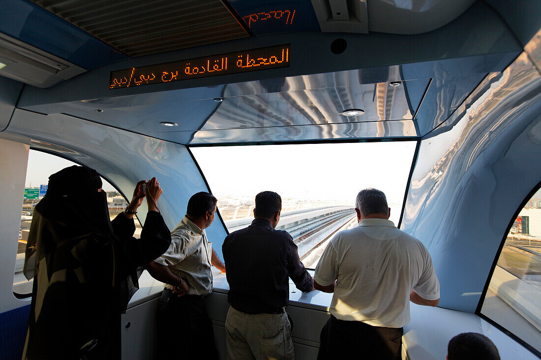 arabian women in new Metro line, Downtown Dubai