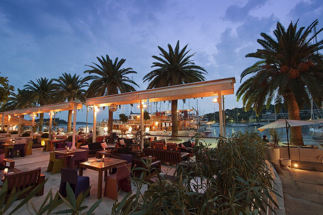 Restaurant and Bar at the Promenade of Hvar at dusk, Croatia