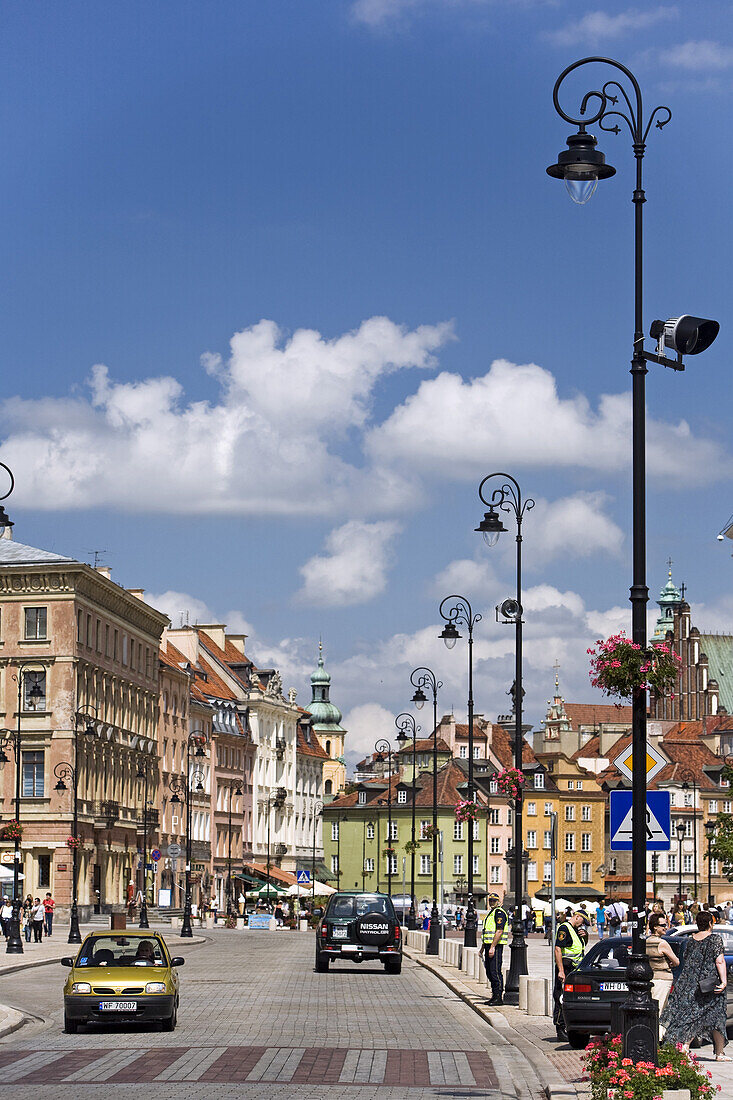 The Krakowskie Przedmiescie Street under clouded sky, Warsaw, Poland, Europe