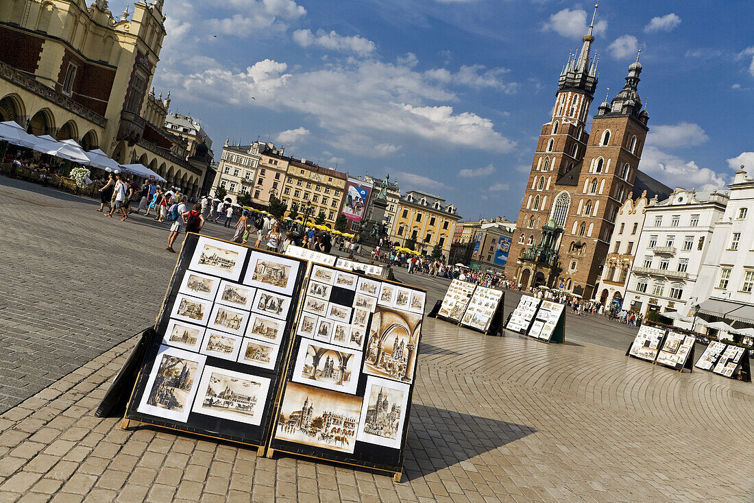 Artwork for sale on Main Market Square Rynek Glowny in front of St. Mary's Basilica Kosciól Mariacki, Krakow, Poland, Europe