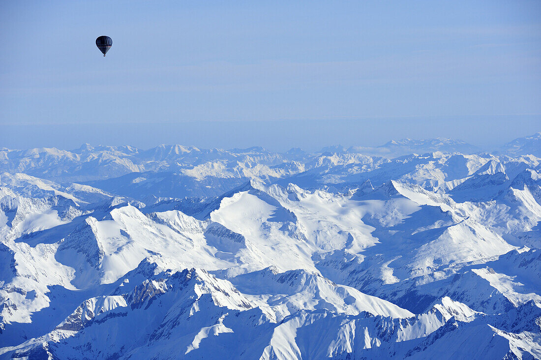 Hot-air balloon flying high above Zillertal range with Schrammacher, Karwendel range in background, aerial photo, Zillertal range, Tyrol, Austria, Europe