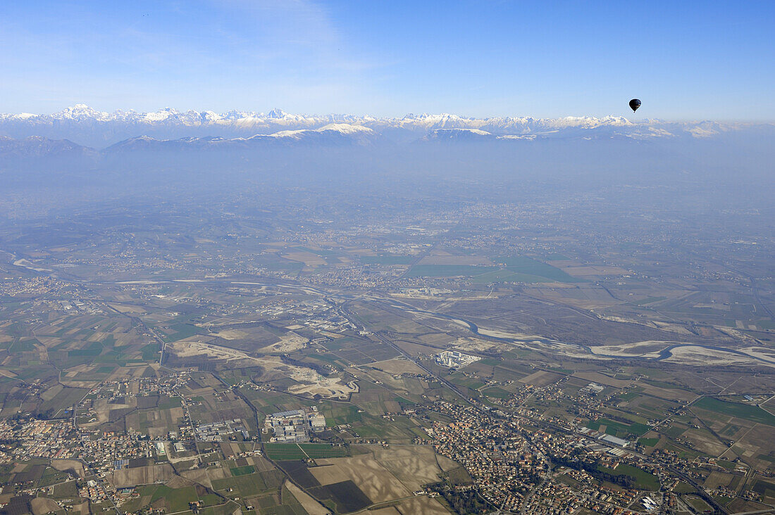 Hot-air balloon flying high above valley of Piave, Dolomites in background, aerial photo, Dolomites, Venetia, Italy, Europe