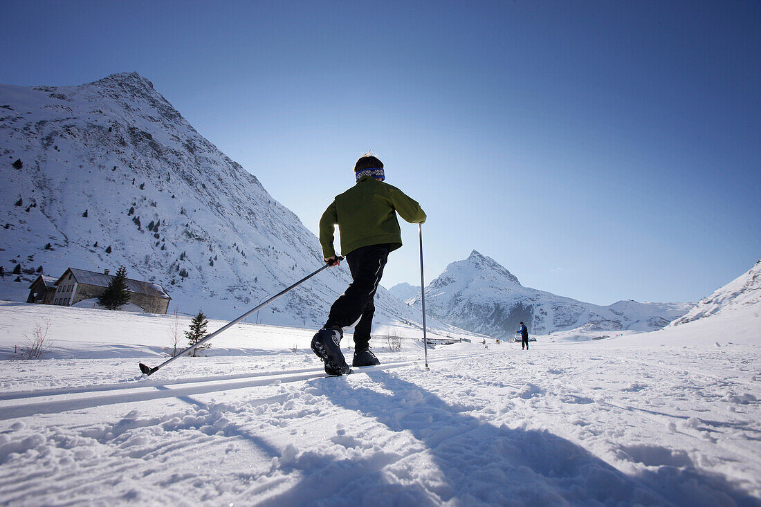 Cross-country skier in Paznaun valley, Galtuer, Tyrol, Austria