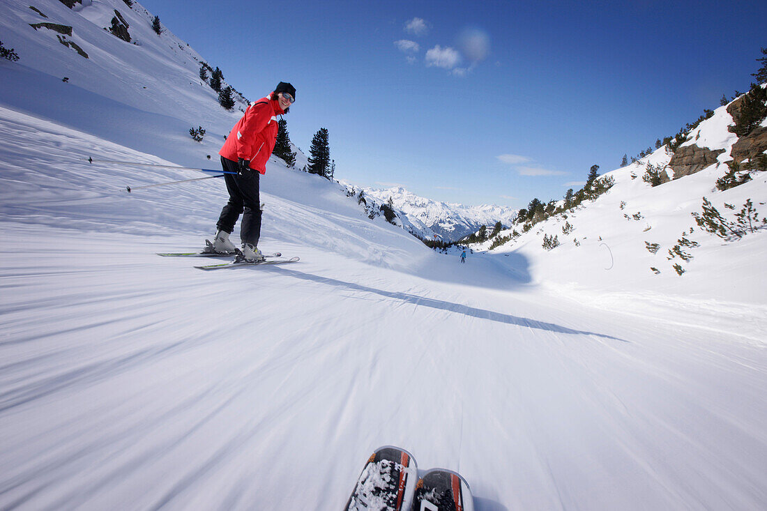 Woman skiing downhill, Galtuer, Paznaun valley, Tyrol, Austria