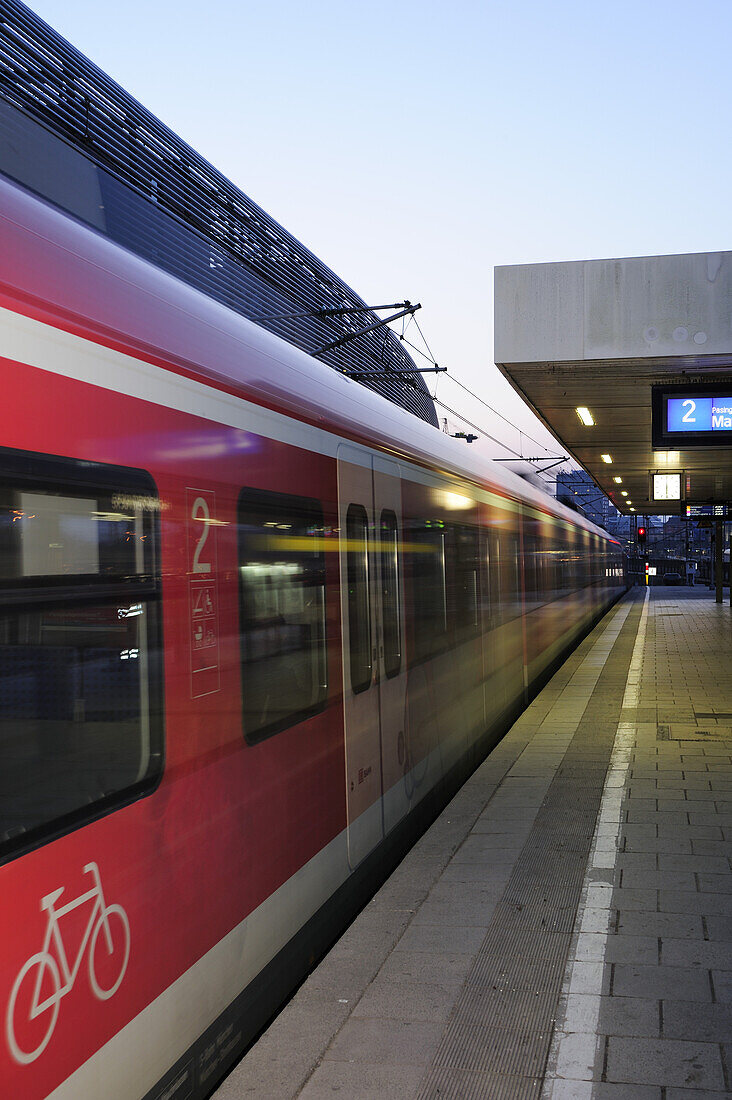 Platform with suburban train in motion, Munich, Upper Bavaria, Bavaria, Germany