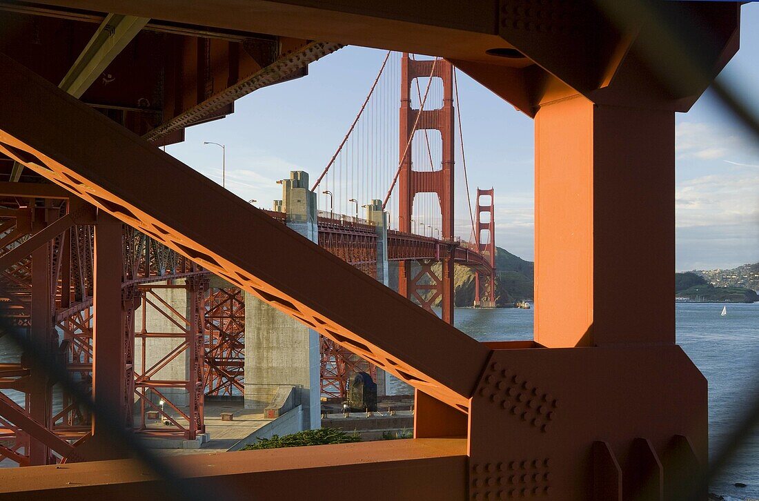 USA, California, San Francisco, Golden Bridge looking north through gap in chain-link fence, NR