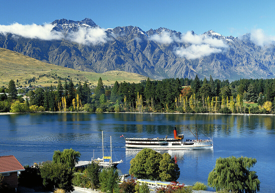Steamship ´Earnslaw´ heading out on Lake Wakatipu the Remarkables behind New Zealand