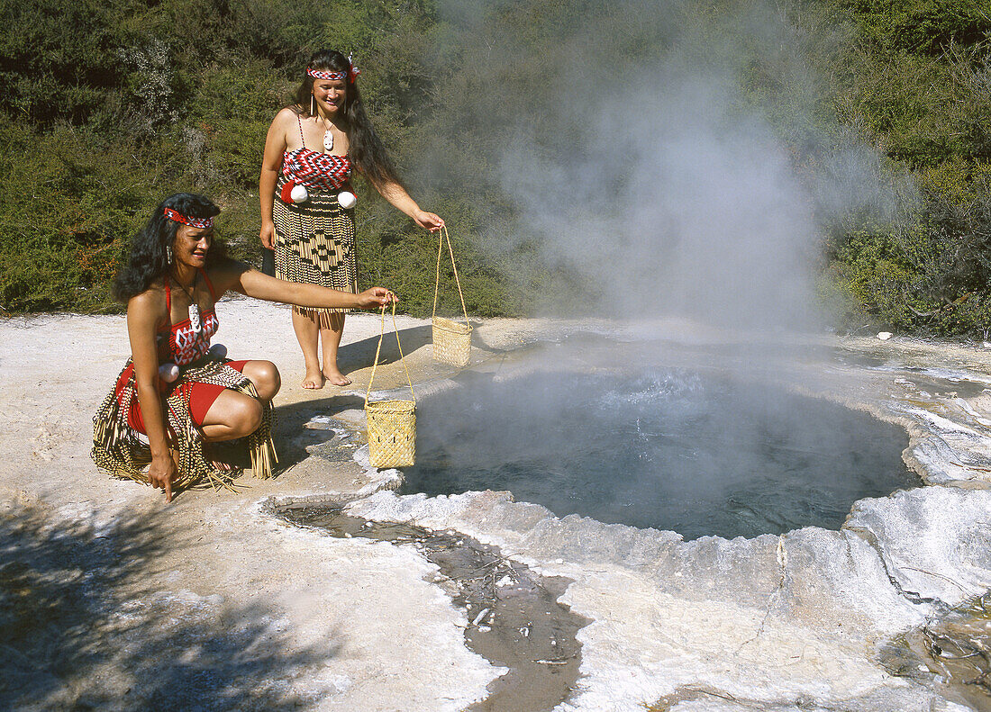 Maori women cooking food in hot pool Whakarewarewa Rotorua New Zealand