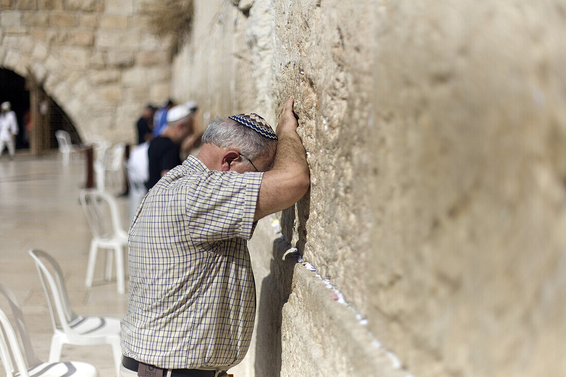 Man worshipping at the Wailing Wall, Jerusalem, Israel, Middle East