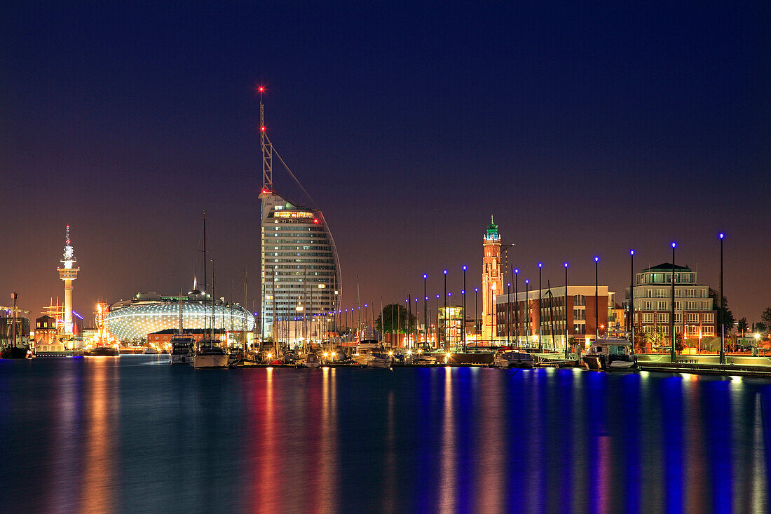 New harbour with television tower, Klimahaus 8° Ost, Atlantic Hotel Sail City and lighthouse Loschenturm at night, Bremerhaven, Hanseatic City of Bremen, Germany, Europe