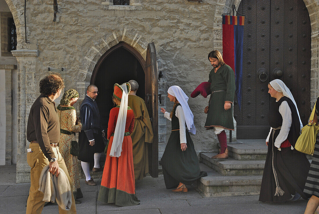 People in costumes at medieval market in front of town hall, Tallinn, Estonia, Europe